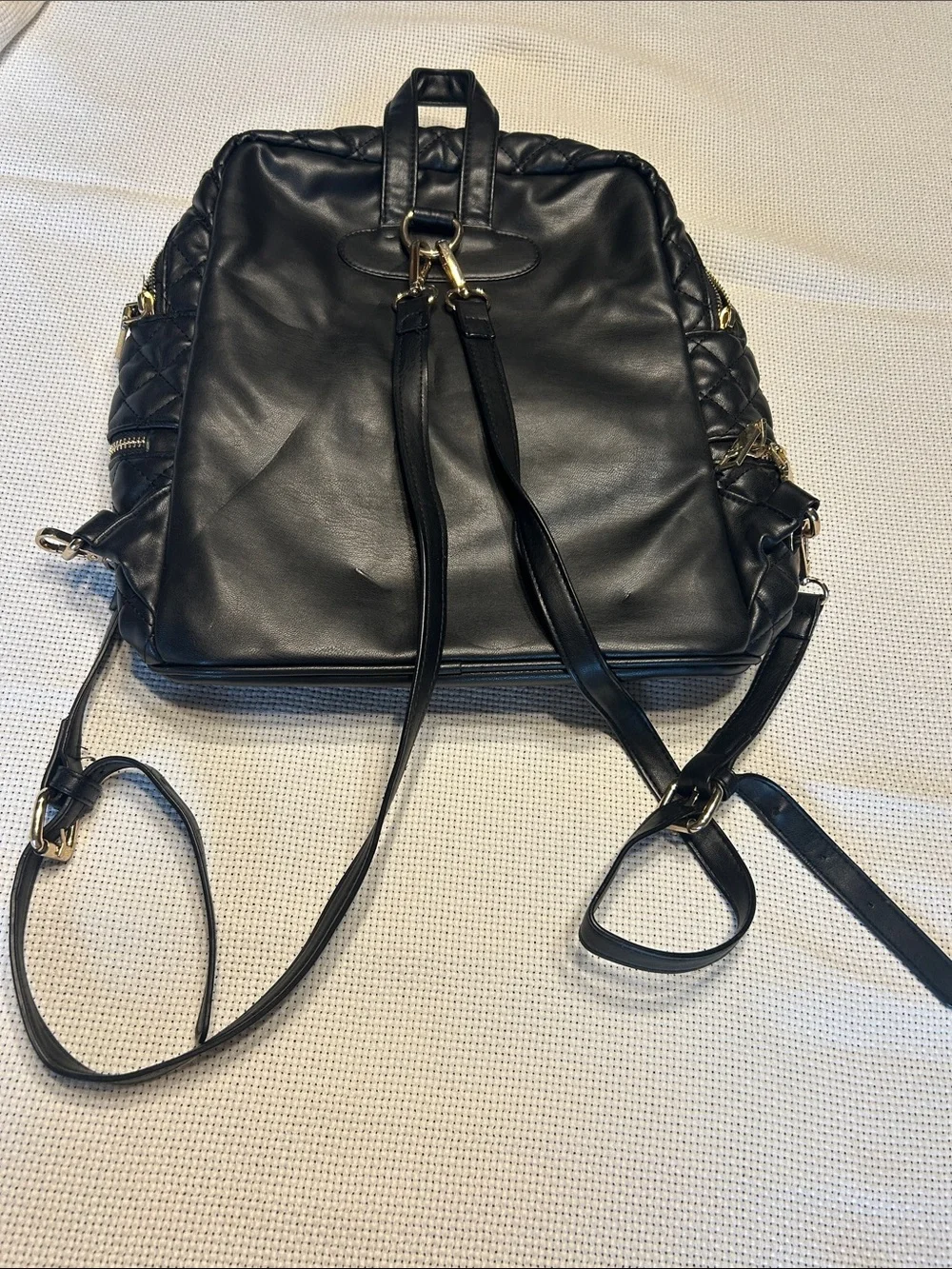 bebe Black Quilted Leather Backpack with Gold Plate